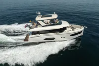 Luxury Absolute 52 Navetta yacht cruising on open water, 2021 model.