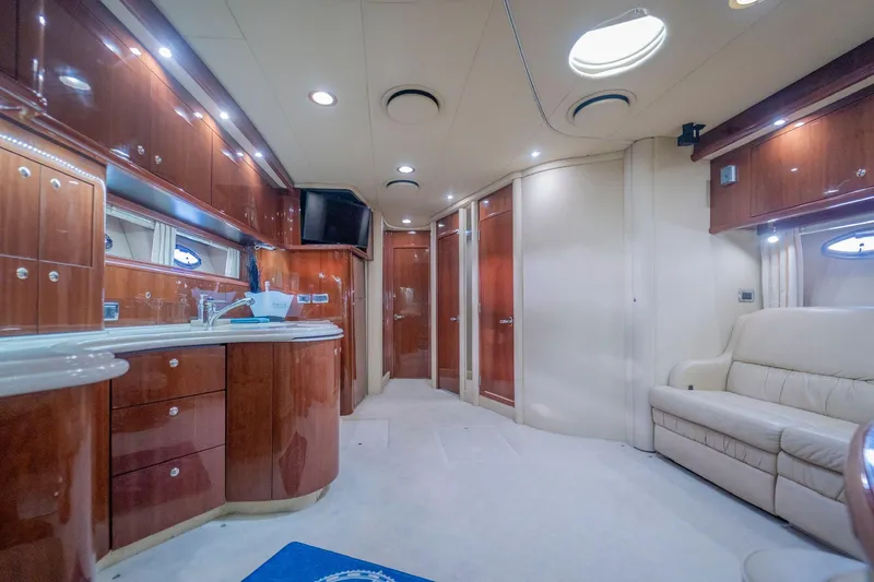  Yacht Photos Pics Luxurious interior of 2002 Sea Ray 510 Sundancer yacht with elegant wood finishes.