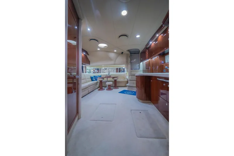  Yacht Photos Pics Luxurious interior of 2002 Sea Ray 510 Sundancer yacht with elegant seating and cabinetry.