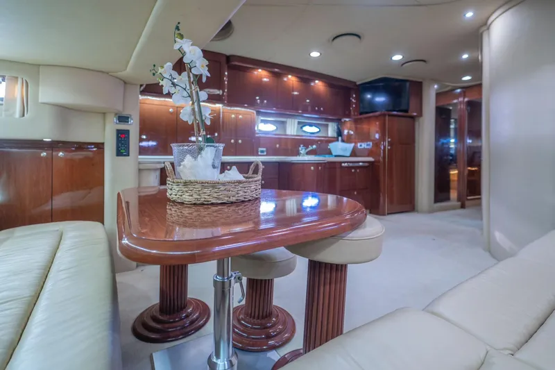  Yacht Photos Pics Luxurious interior of 2002 Sea Ray 510 Sundancer yacht with elegant wood finishes.