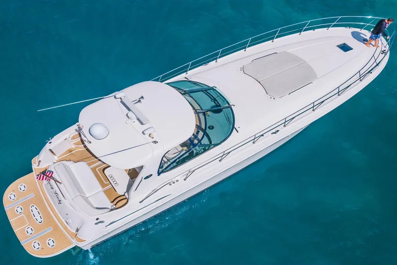  Yacht Photos Pics Aerial view of 2002 Sea Ray 510 Sundancer yacht on clear blue water.