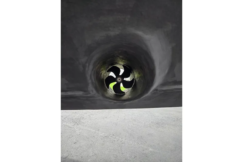 Let's Go! Yacht Photos Pics Close-up of a 2007 Fountain 38 Express Cruiser's propeller in a tunnel.