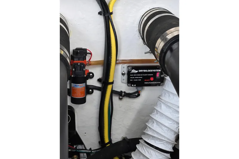 Let's Go! Yacht Photos Pics Engine room of 2007 Fountain 38 Express Cruiser with Seaflo pump and dry bilge system.