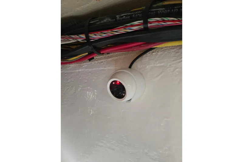Let's Go! Yacht Photos Pics Security camera installed on a 2007 Fountain 38 Express Cruiser, near colorful wiring.