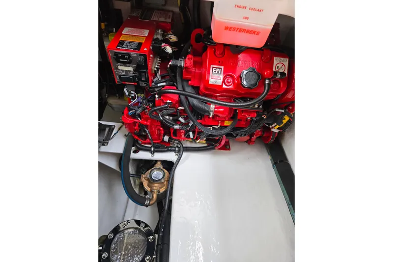 Let's Go! Yacht Photos Pics Engine compartment of 2007 Fountain 38 Express Cruiser with Westerbeke generator.