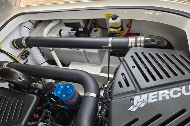 Let's Go! Yacht Photos Pics Engine compartment of 2007 Fountain 38 Express Cruiser with Mercury components.