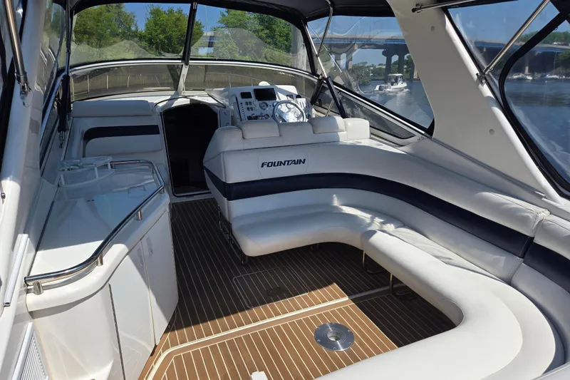 Let's Go! Yacht Photos Pics 2007 Fountain 38 Express Cruiser interior with sleek seating and modern dashboard.