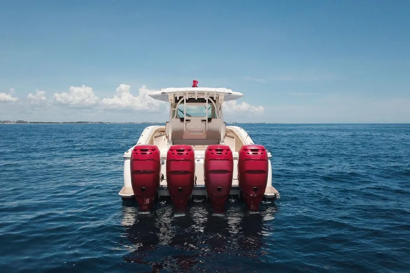  Yacht Photos Pics 2020 Scout 380 LXF boat with four red outboard engines on open sea.