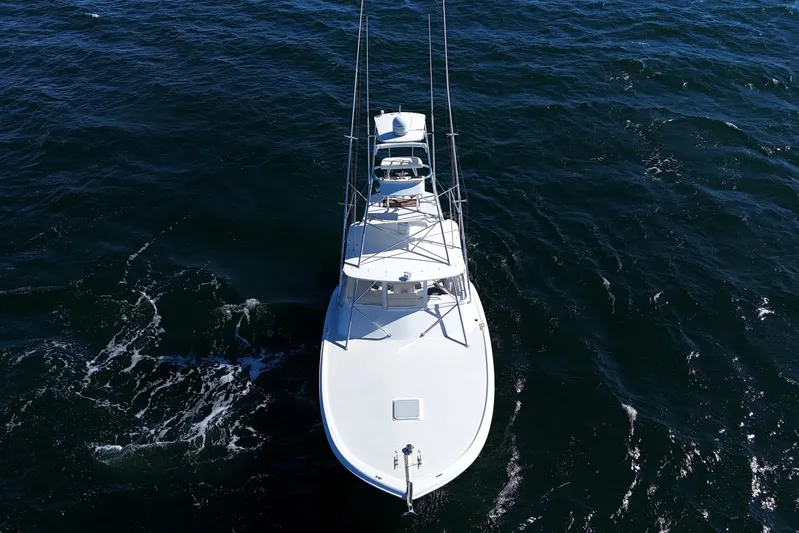 Reel Blessings Yacht Photos Pics 2006 Out Island 38 Express boat cruising on open water, aerial view.