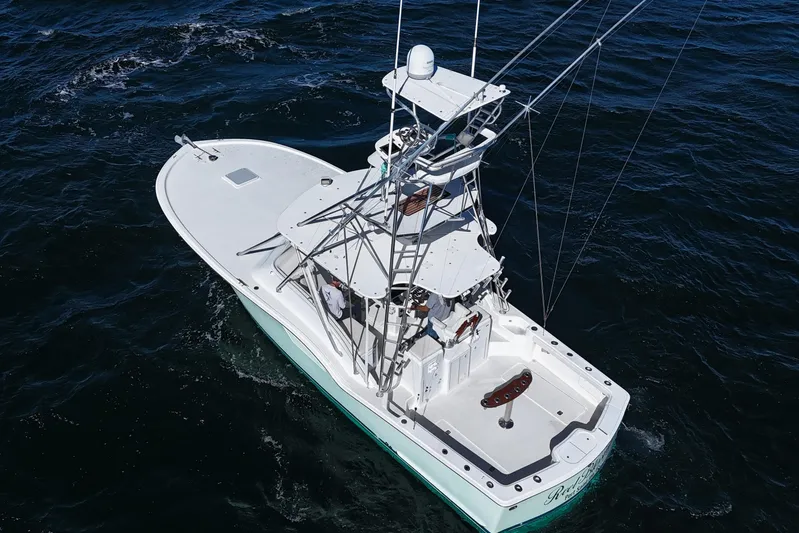 Reel Blessings Yacht Photos Pics 2006 Out Island 38 Express boat navigating on open water, aerial view.