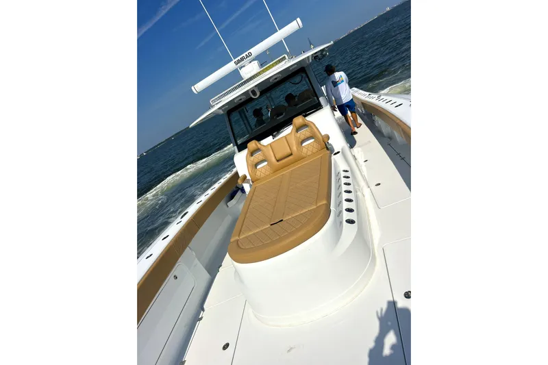 Lafe Yacht Photos Pics 2026 Freeman 47 boat cruising on open water, featuring tan seating and modern design.