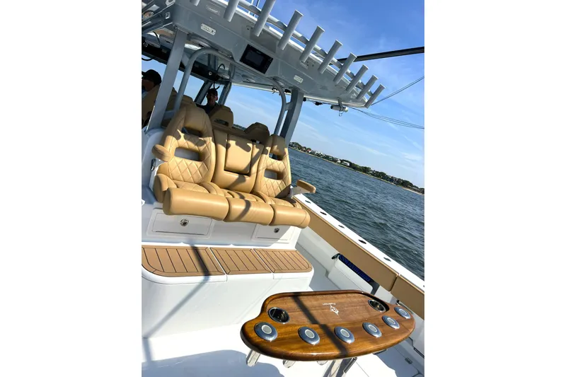 Lafe Yacht Photos Pics Luxurious seating on a 2026 Freeman 47 boat, featuring tan leather and ocean backdrop.