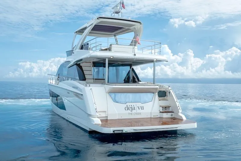  Yacht Photos Pics Luxury Absolute 62 Fly yacht cruising on calm ocean waters, 2023 model.