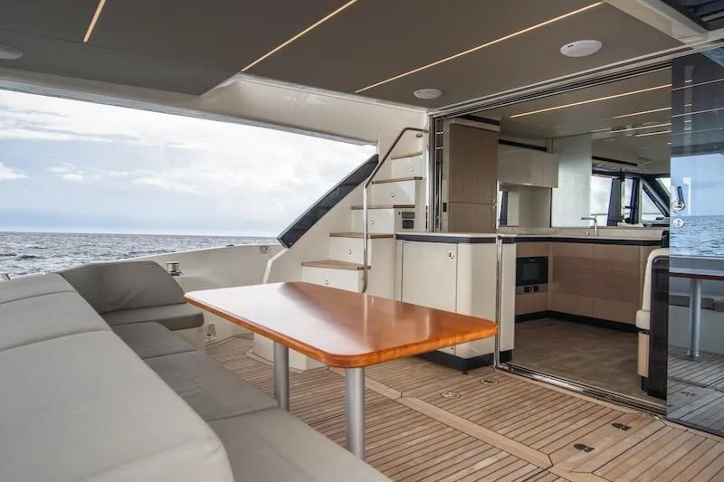  Yacht Photos Pics Luxurious 2023 Absolute 62 Fly yacht interior with modern kitchen and ocean view.
