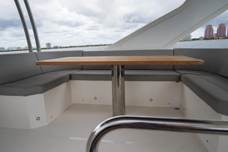  Yacht Photos Pics Luxurious seating area on 2023 Absolute 62 Fly yacht with ocean view.