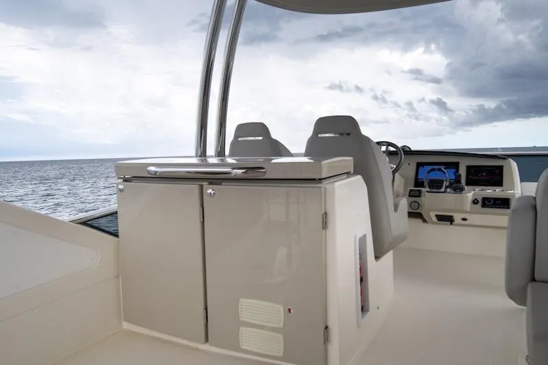  Yacht Photos Pics 2023 Absolute 62 Fly yacht helm with modern controls and ocean view.