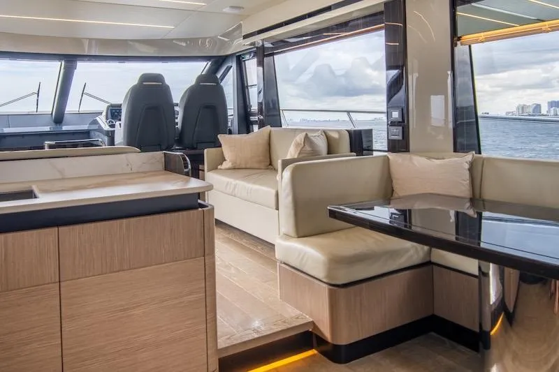  Yacht Photos Pics Luxurious interior of 2023 Absolute 62 Fly yacht with modern seating and ocean view.