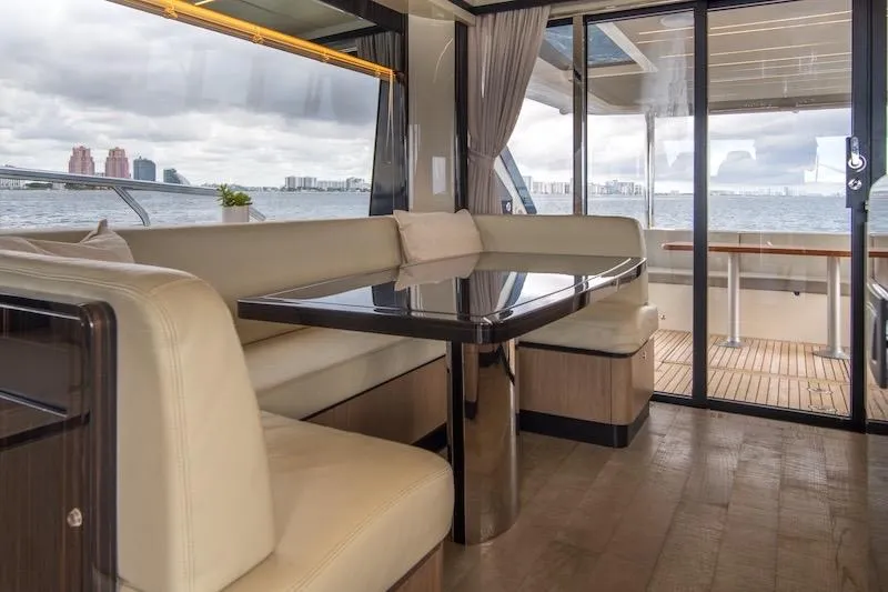  Yacht Photos Pics Luxurious interior of 2023 Absolute 62 Fly yacht with elegant seating and ocean view.