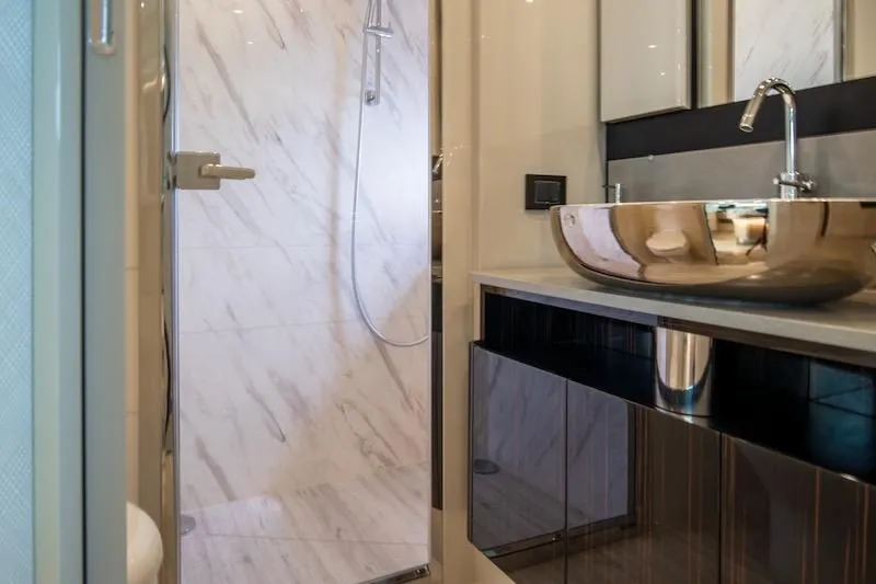  Yacht Photos Pics Luxurious bathroom in 2023 Absolute 62 Fly yacht with modern sink and shower.