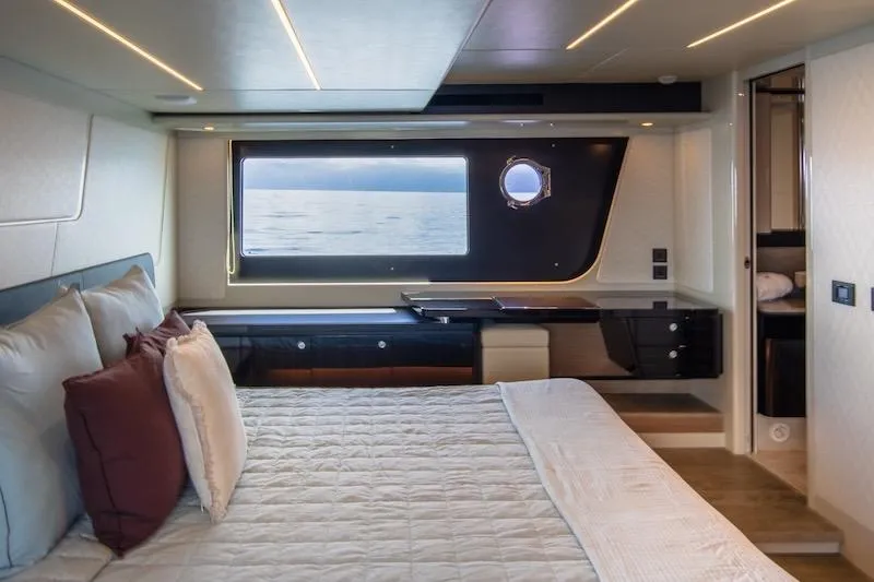  Yacht Photos Pics Luxurious bedroom interior of 2023 Absolute 62 Fly yacht with ocean view.