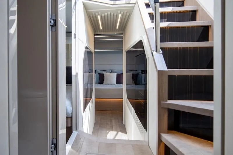  Yacht Photos Pics Luxurious interior of 2023 Absolute 62 Fly yacht with modern staircase and elegant design.