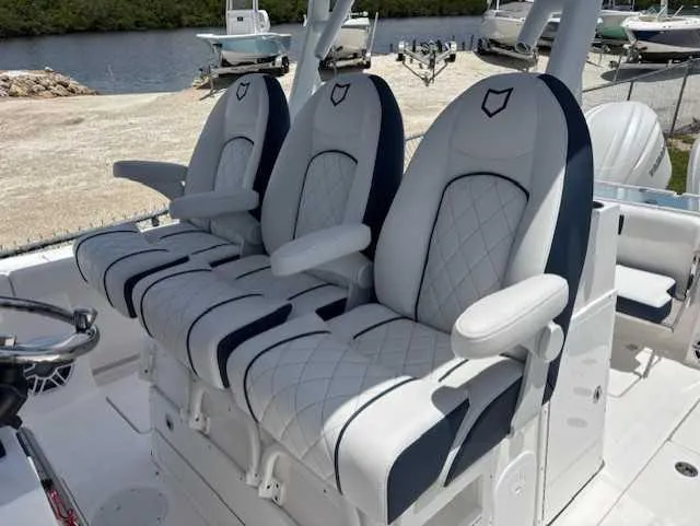 Black Label Marine Yacht Photos Pics 2025 Sea Fox 328 Commander boat seats with elegant white and navy design.