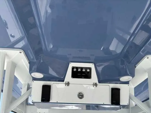 Black Label Marine Yacht Photos Pics 2025 Sea Fox 328 Commander boat interior with blue ceiling and control panel.