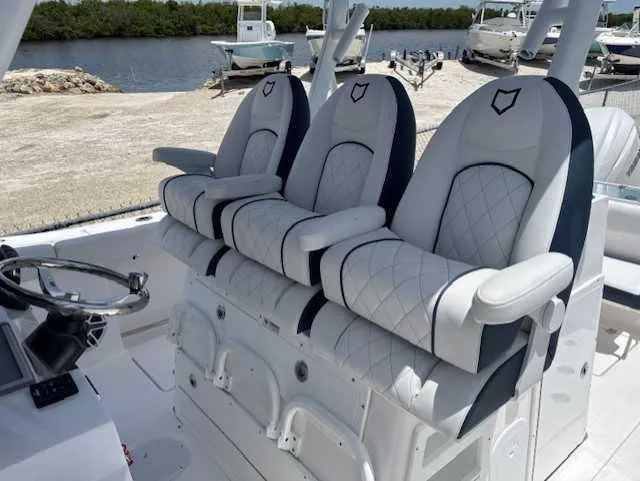 Black Label Marine Yacht Photos Pics 2025 Sea Fox 328 Commander boat seats with elegant white and black design.