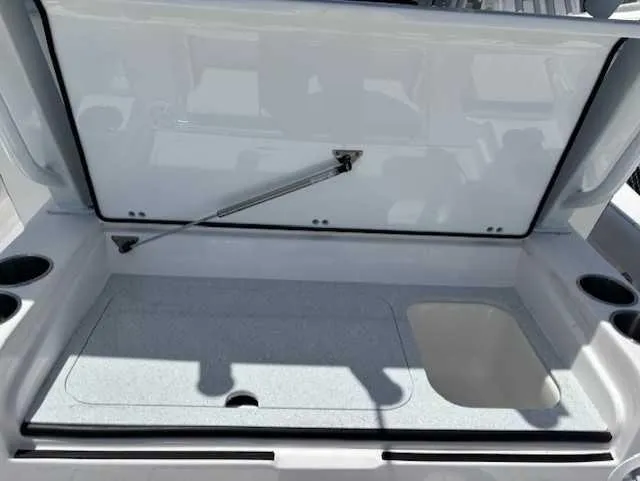 Black Label Marine Yacht Photos Pics 2025 Sea Fox 328 Commander storage compartment with open lid and cup holders.