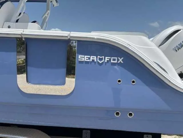 Black Label Marine Yacht Photos Pics 2025 Sea Fox 328 Commander boat, blue hull, side view with logo.
