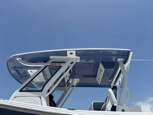 Black Label Marine Yacht Photos Pics 2025 Sea Fox 328 Commander boat with sleek T-top against clear blue sky.