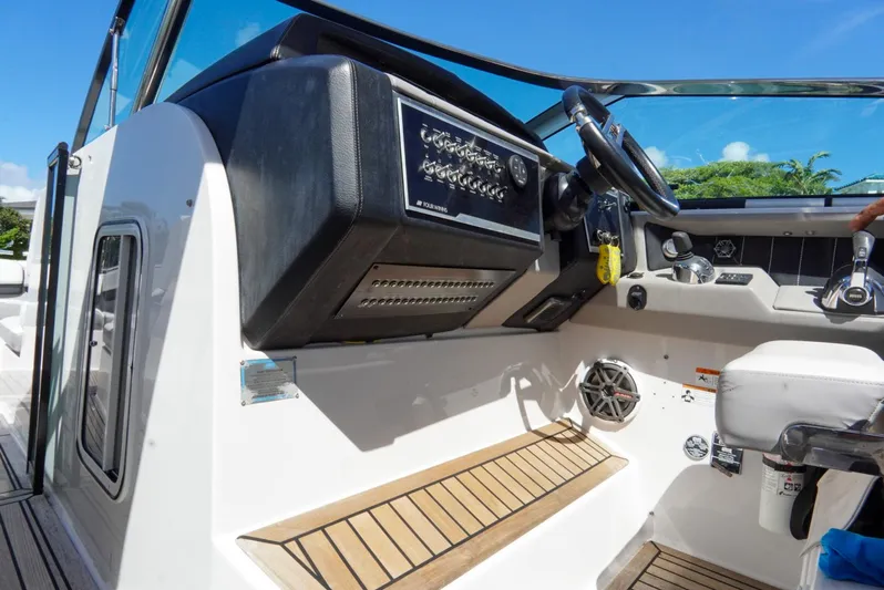  Yacht Photos Pics 2017 Four Winns H350 boat cockpit with steering wheel and control panel.
