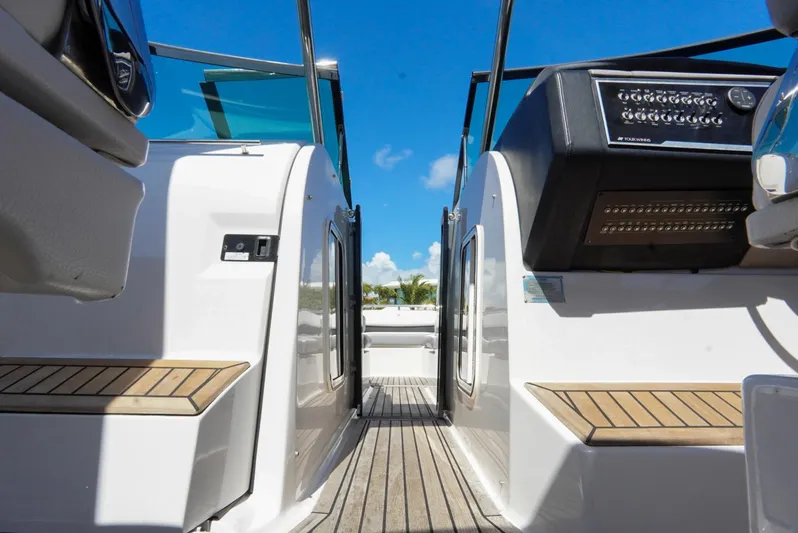  Yacht Photos Pics 2017 Four Winns H350 boat interior with wooden deck and control panel.