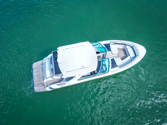  Yacht Photos Pics Aerial view of 2017 Four Winns H350 boat on clear water.