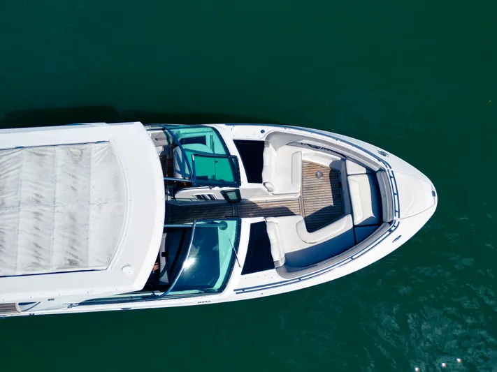  Yacht Photos Pics Aerial view of 2017 Four Winns H350 boat on green water.