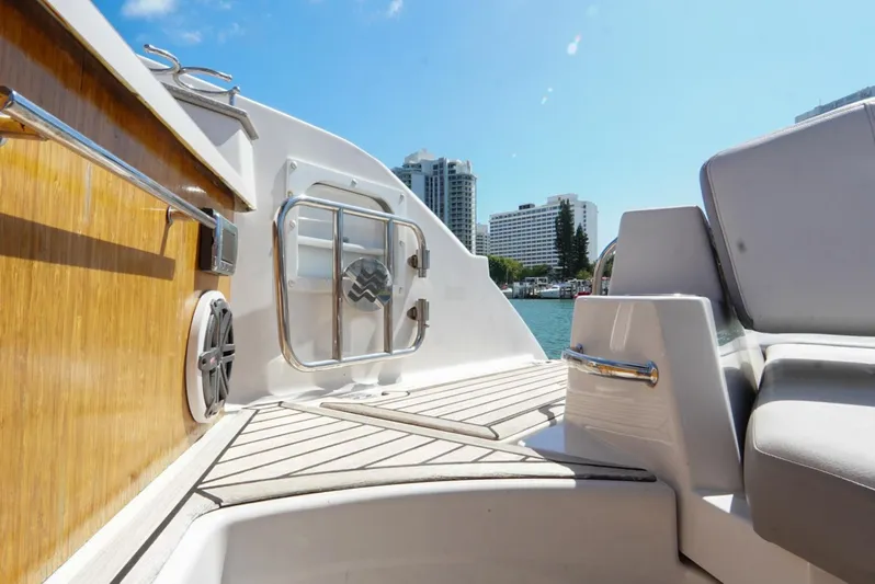  Yacht Photos Pics 2017 Four Winns H350 boat interior with city skyline in background.
