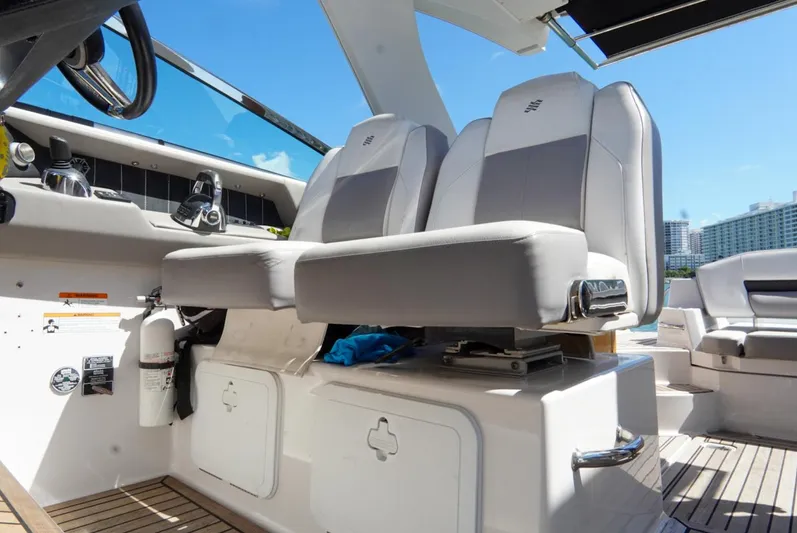  Yacht Photos Pics 2017 Four Winns H350 boat interior with dual captain seats and control panel.