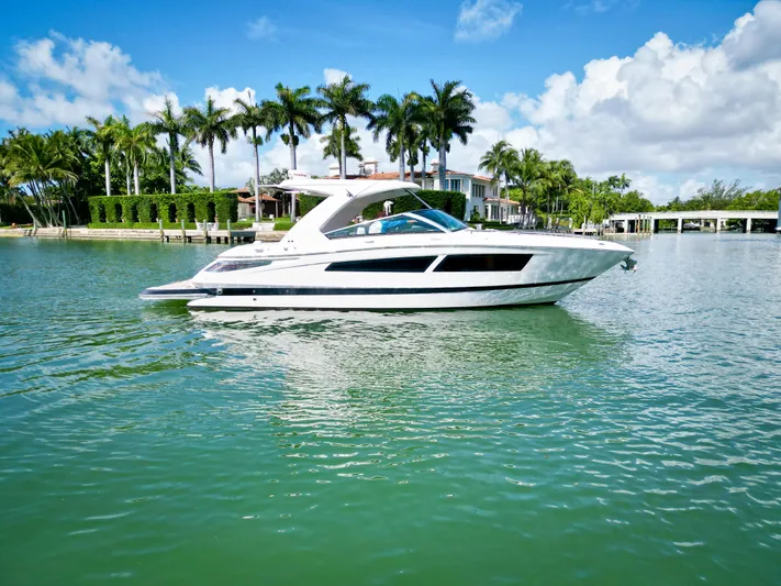  Yacht Photos Pics 2017 Four Winns H350 boat on a tropical waterway with palm trees.