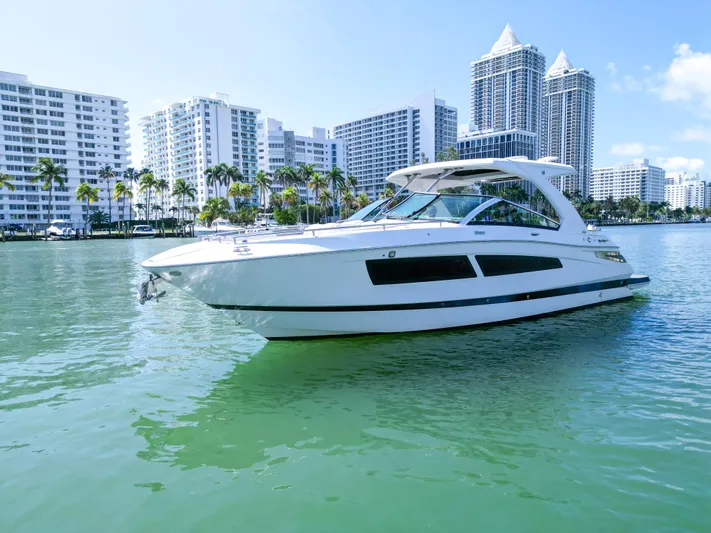  Yacht Photos Pics 2017 Four Winns H350 yacht cruising in urban waterfront setting.