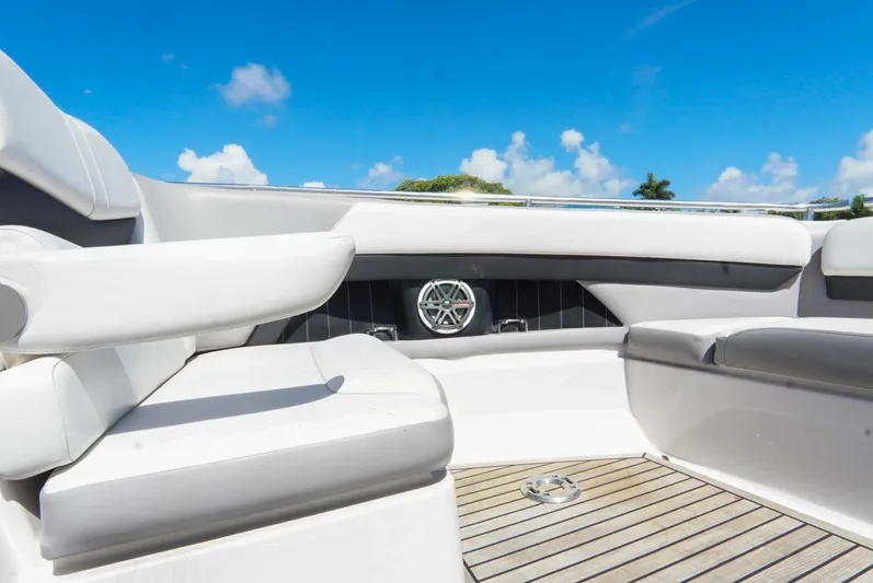  Yacht Photos Pics 2017 Four Winns H350 boat interior with white seating and wooden deck under blue sky.