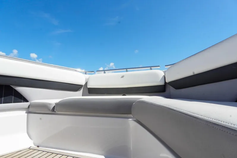  Yacht Photos Pics 2017 Four Winns H350 boat interior with white seating under clear blue sky.