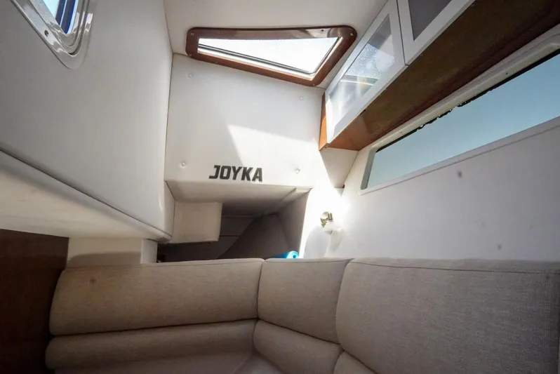  Yacht Photos Pics Interior cabin of 2017 Four Winns H350 boat with beige seating and skylight.
