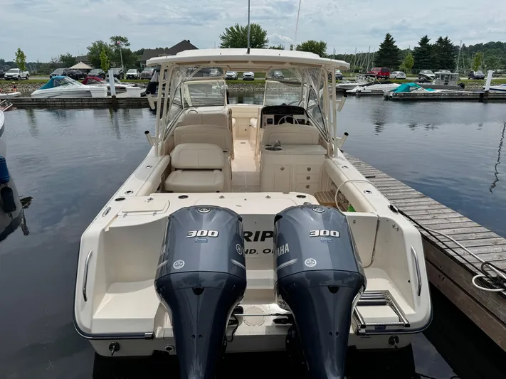 Bay Tripper Yacht Photos Pics 2019 Grady-White Freedom 307 boat docked with twin Yamaha 300 engines.