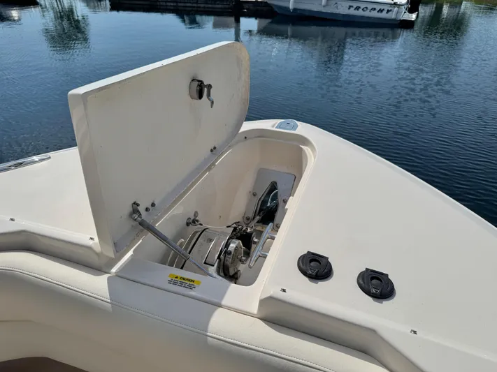Bay Tripper Yacht Photos Pics 2019 Grady-White Freedom 307 boat anchor compartment open on calm water.