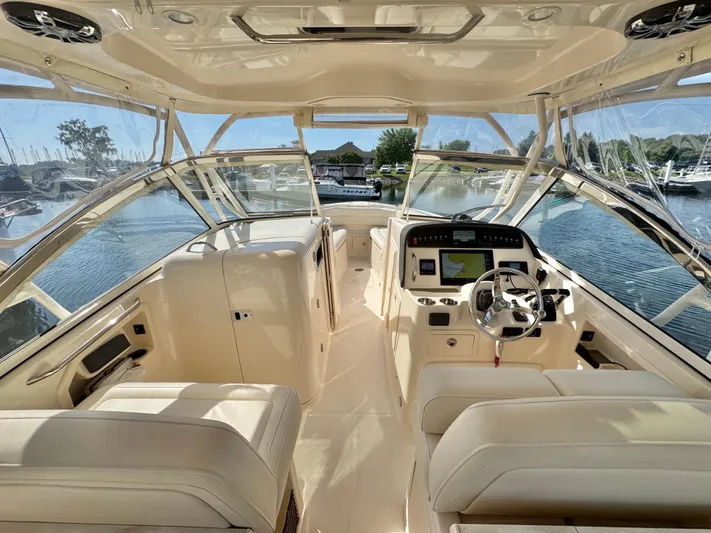 Bay Tripper Yacht Photos Pics 2019 Grady-White Freedom 307 boat interior with helm, seats, and navigation equipment.