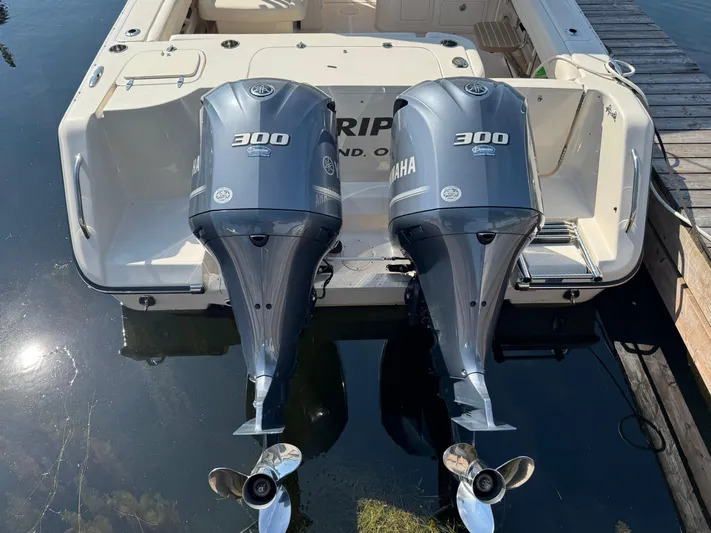 Bay Tripper Yacht Photos Pics 2019 Grady-White Freedom 307 boat with twin Yamaha 300 outboard engines docked.