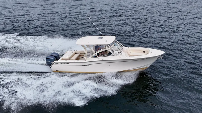 Bay Tripper Yacht Photos Pics 2019 Grady-White Freedom 307 boat cruising on open water.