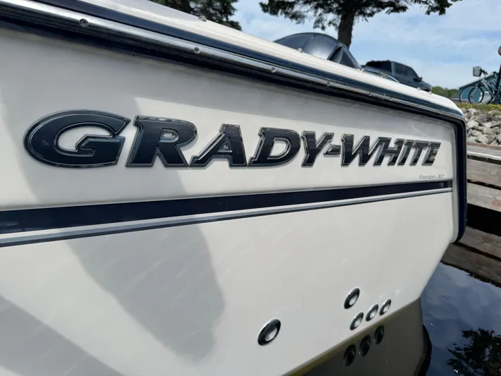 Bay Tripper Yacht Photos Pics 2019 Grady-White Freedom 307 boat, close-up of logo and model name.