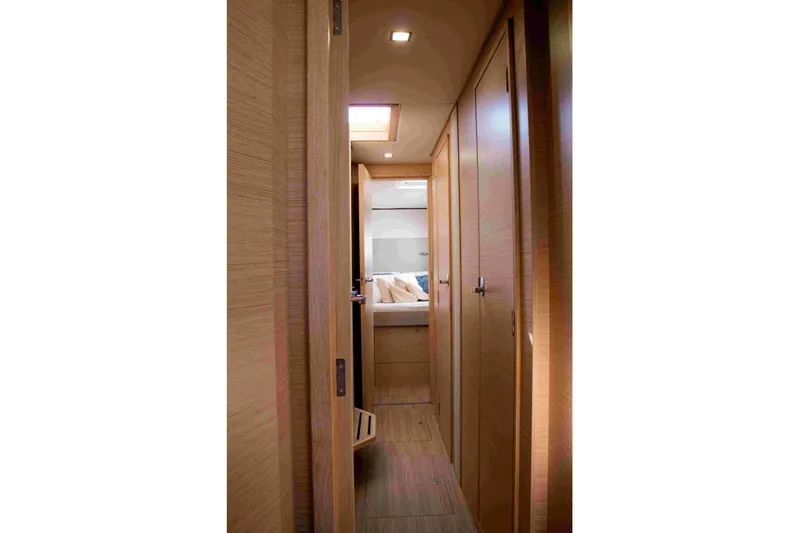 Double Memory Yacht Photos Pics Interior hallway of 2023 Nautitech 44 Open yacht, featuring wooden finishes and modern design.