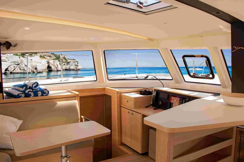 Double Memory Yacht Photos Pics Interior of 2023 Nautitech 44 Open yacht with scenic ocean view through windows.
